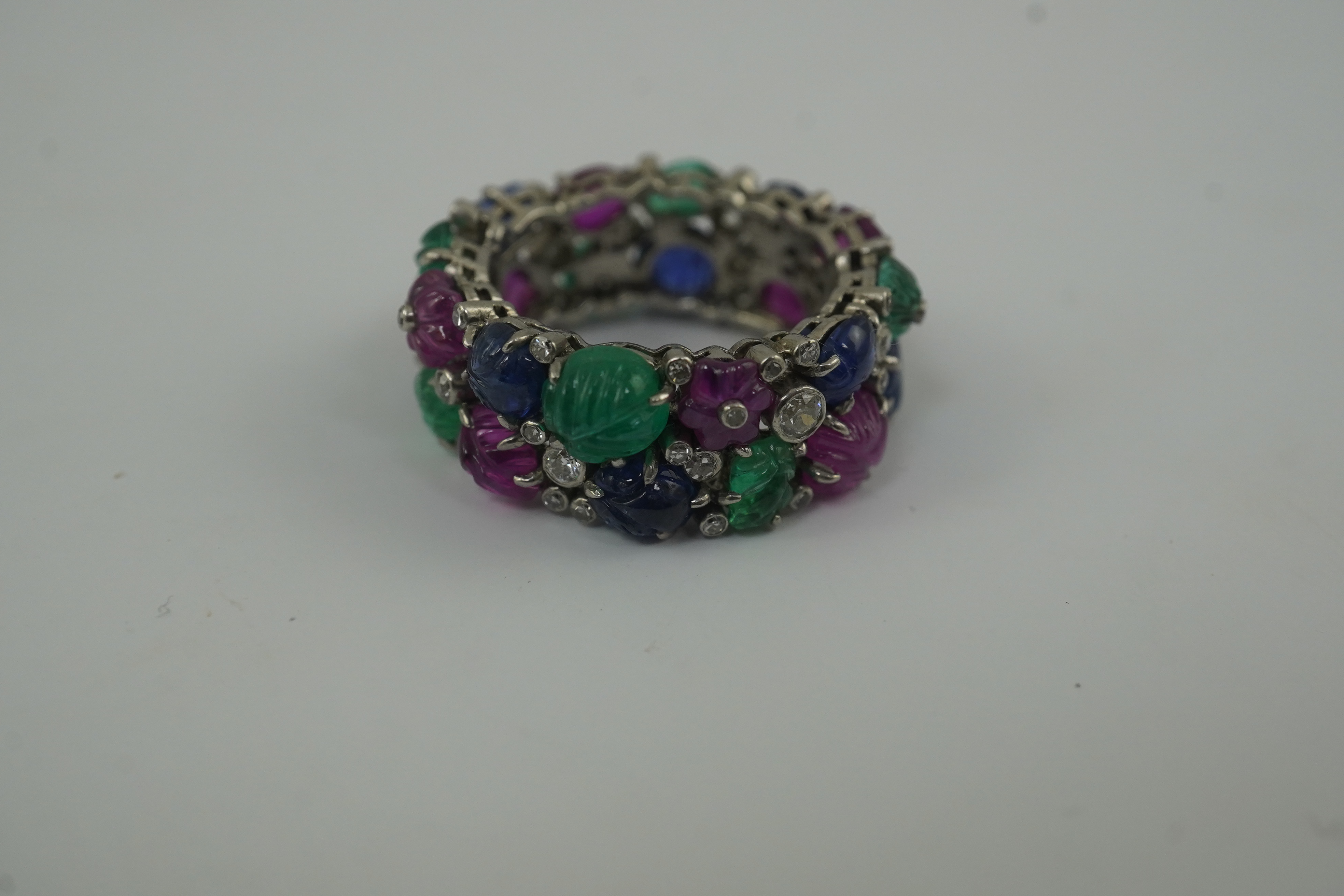 A Mauboussin style platinum, ruby, emerald, sapphire and diamond set 'Tutti Frutti' ring